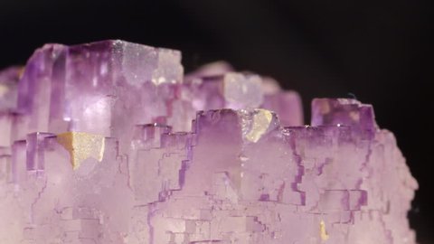 MACRO CLOSEUP Transparent cube formation of violet semi precious Amethyst. Purple fluorite with glassy texture that is almost see through. Ancient gemstone considered to protect owner from drunkenness
