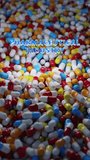 Pharmaceutical industry bunch of various colors white capsule pills on a white background - Medicine healthcare medicament. 3D vertical video animation
