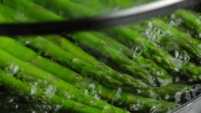 Process cooking asparagus in boiling water - Powered by Shutterstock - Get 15% off with code: PIKWIZARD15