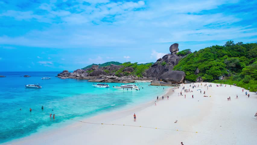 Aerial view of the Similan Islands, Andaman Sea, natural blue waters, tropical sea of Thailand. the beautiful scenery of the island is impressive. Royalty-Free Stock Footage #3485925657