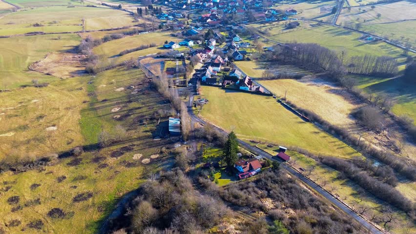 Overhead View of Quaint Hamlet Surrounded by Early Spring Hues