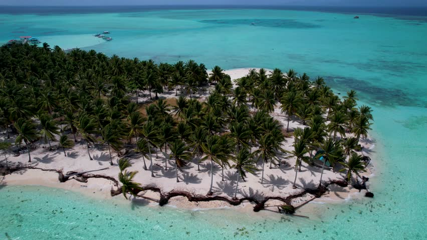 4K Aerial Drone video of beautiful tropical island Onok with white sand beaches, turtles, boats and turquoise blue water in Balabac, Philippines Royalty-Free Stock Footage #3486028621