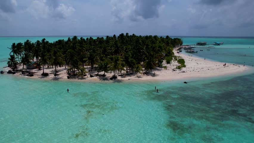 4K Aerial Drone video of beautiful tropical island Onok with white sand beaches, turtles, boats and turquoise blue water in Balabac, Philippines Royalty-Free Stock Footage #3486032583