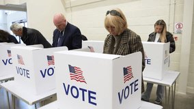 4K: Senior Caucasian Woman Voting at Polling Place for the USA Presidential Election. 70-74 years. People vote around her. Gimbal around. Stock Video Clip Footage - Powered by Shutterstock - Get 15% off with code: PIKWIZARD15