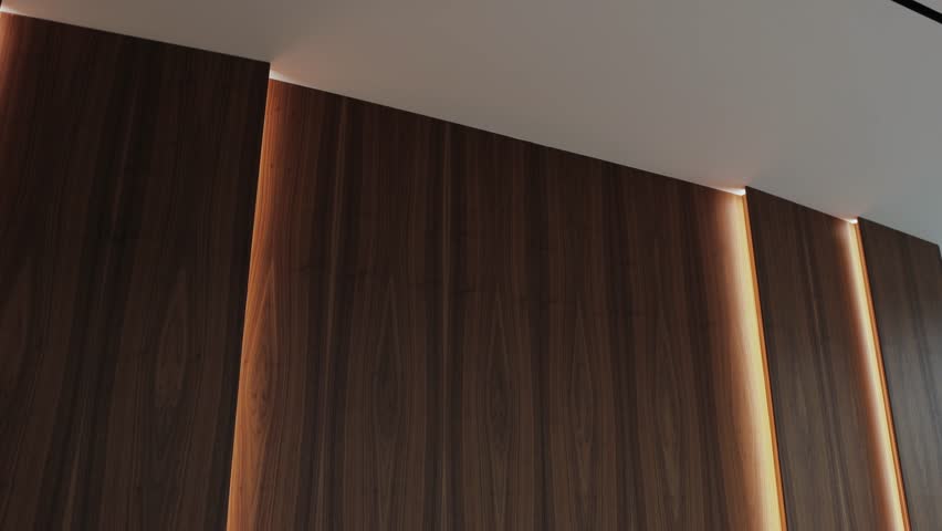 a close up of a wooden wall with a light behind it