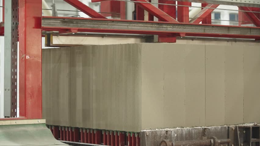 Cutting the hardened mixture with strings into blanks for the production of aerated concrete blocks for subsequent processing Royalty-Free Stock Footage #3486067961