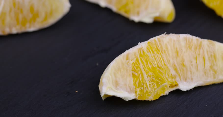 peeled orange slices on the table, juicy and delicious orange without peel