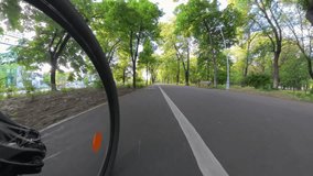 Bike riding point of view 4K video. Wide angle view from standing point of a biker while cycling on the bike path inside a city. Commute with bike is a healthy way to live.