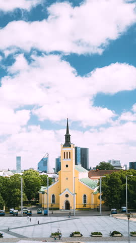 Tallinn, Estonia. Church Of St. John Jaani Kirik At Sunny Summer Day. Vertical Footage Video Large Lutheran Parish Church In Tallinn Dedicated To St. John The Evangelist, Disciple Of Jesus Christ.