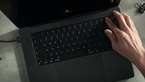 Laptop User Opens the Device, Plugged into Power, and Unlocks It Using the Built-in Fingerprint Scanner, Dolly in - Powered by Shutterstock - Get 15% off with code: PIKWIZARD15