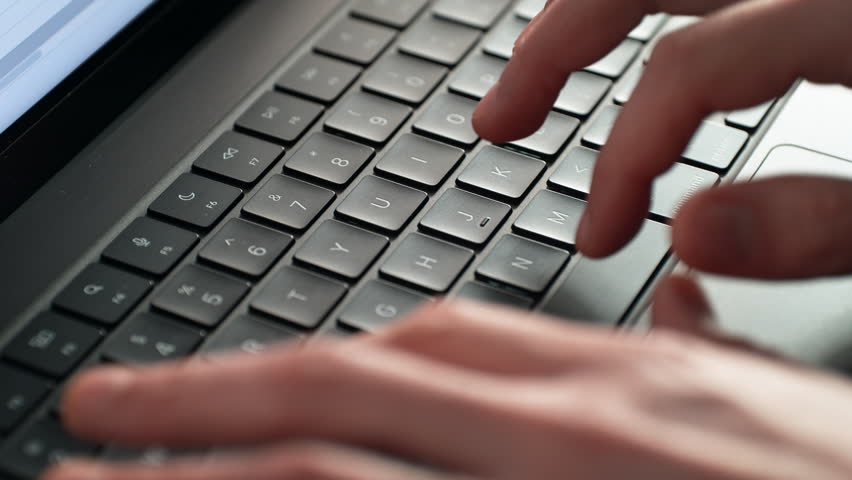 Alphanumeric Keys of the Laptop Keyboard Being Tapped by Fingers - Letters and Numbers are in Focus, the Hands Are Blurred - Powered by Shutterstock - Get 15% off with code: PIKWIZARD15