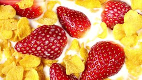 Morning Bliss: 4K Close-Up Video of Fresh Corn Flakes, Milk, and Strawberries