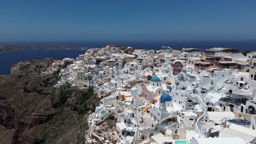 Drone flight over Oia, Santorini on a clear day