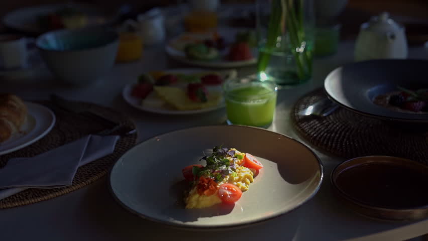 Breakfast omelet with vegetables stands on the table