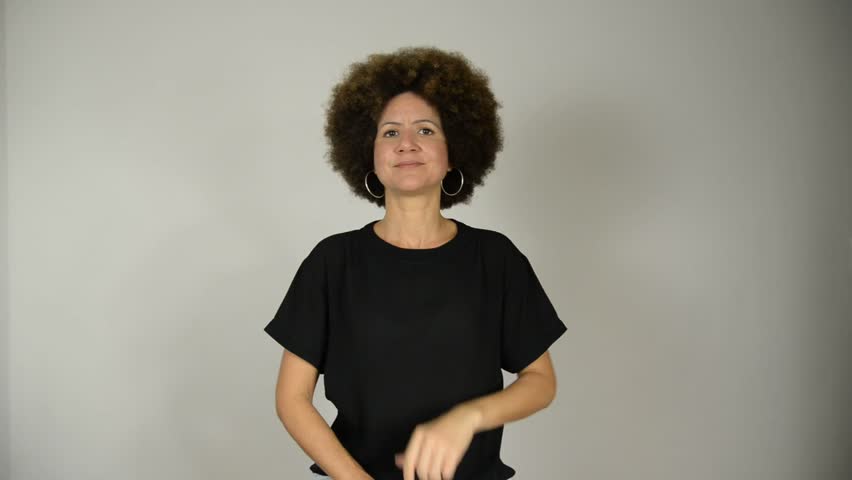 Female interpreter says the phrase its the differences that make us equal in Brazilian sign language. Salvador, Bahia.
