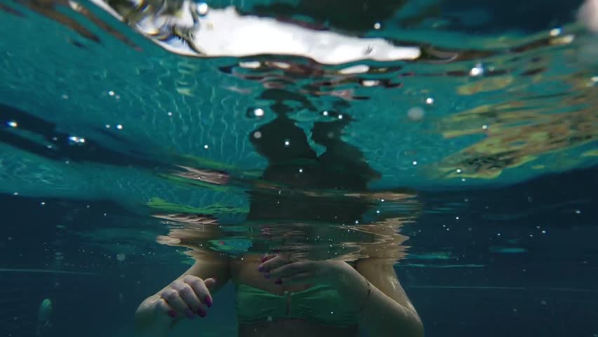 Girl underwater in swinpool