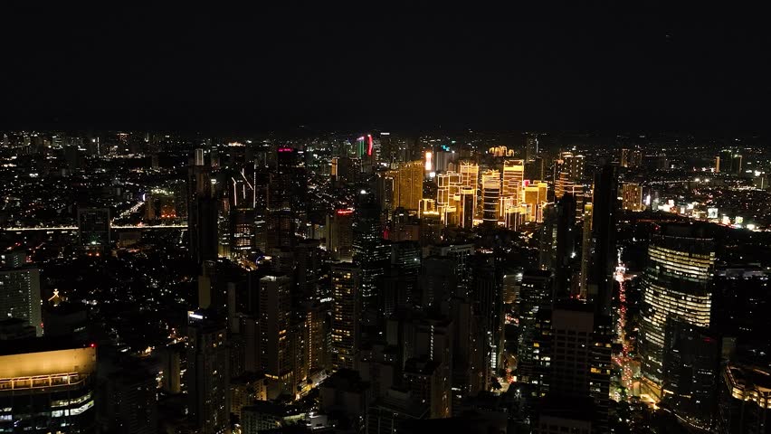 Business Center District in Makati at night view. Luzon, Philippines. Cityscape
