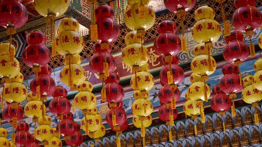Rows of red and yellow paper lanterns inside the Kek Lok Si Temple in George Town, Penang, Malaysia