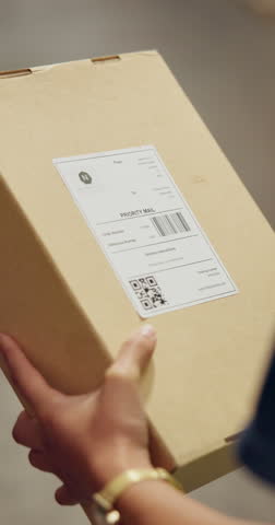 Person, package and hands to scan box for inventory stock take, distribution or supply chain shipping delivery. Ecommerce service, barcode and logistics industry employee working in factory warehouse