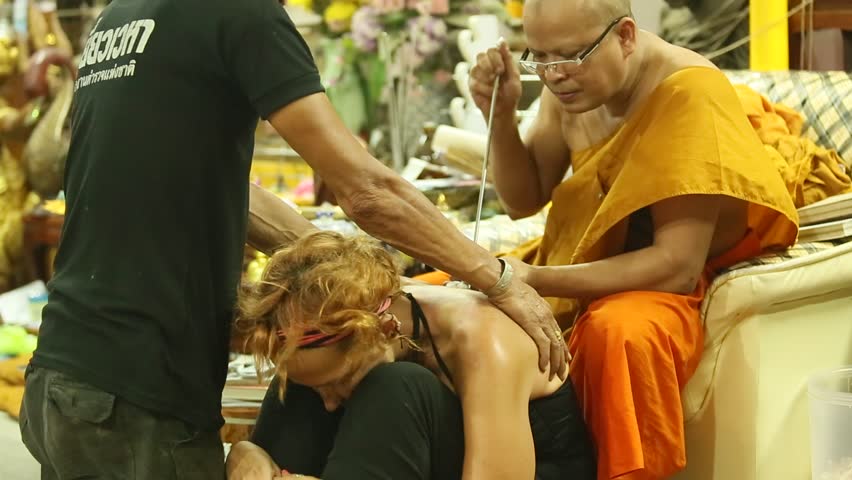 NAKHON CHAI, THAILAND - MAR 1: Unidentified monk makes traditional Yantra