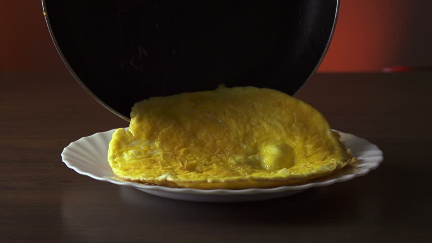 Putting the omelet on a plate slow motion 250fps