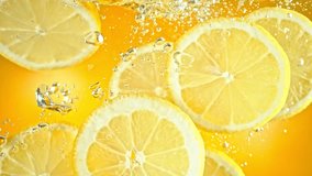 Super Slow Motion Shot of Fresh Lemon Slices Falling and Flowing in Water at 1000 fps. - Powered by Shutterstock - Get 15% off with code: PIKWIZARD15