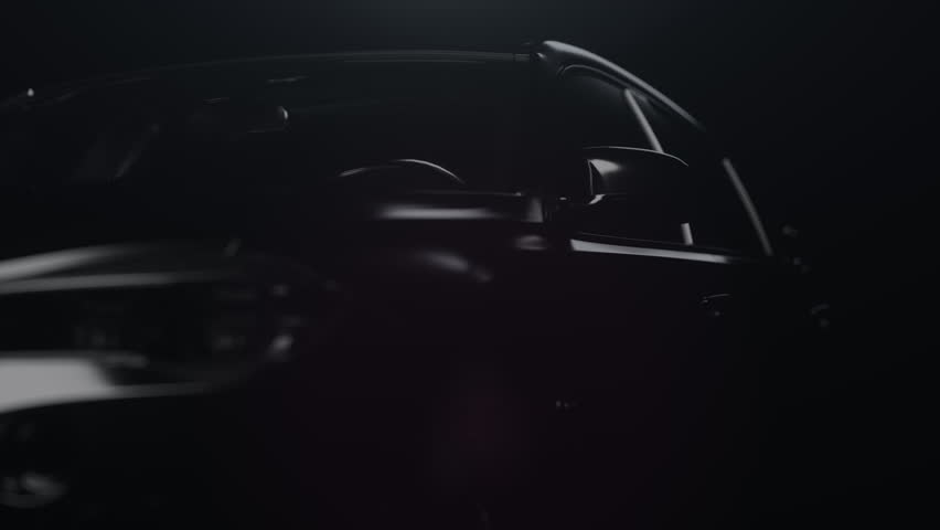 a black car with a dynamic backlight that forms glare on the car body