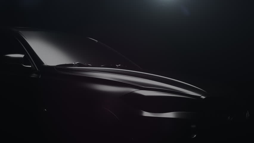 a black car with a dynamic backlight that forms glare on the car body