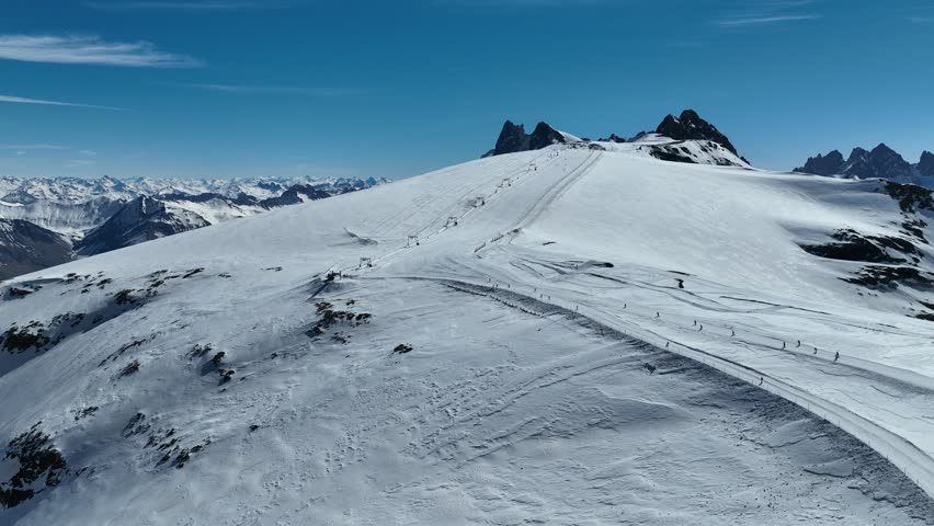 Aerial drone view of  French Alps Mountains glacier near Grenoble. Europe alps in winter. Les deux alpes resort. Winter mountains beautiful alpine panoramic. Mountains aerial snow winter view.