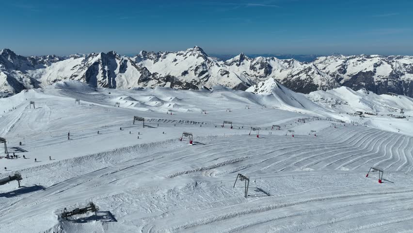 Aerial drone view of  French Alps Mountains glacier near Grenoble. Europe alps in winter. Les deux alpes resort. Winter mountains beautiful alpine panoramic. Mountains aerial snow winter view.