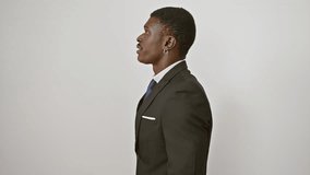 Confident african american man in suit striking a thoughtful pose, side profile with natural smile, looking ahead on isolated white background - Powered by Shutterstock - Get 15% off with code: PIKWIZARD15