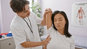 A male physiotherapist examines the arm of a female patient in a rehabilitation clinic room, signifying healthcare and therapy. - Powered by Shutterstock - Get 15% off with code: PIKWIZARD15