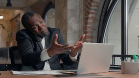 Angry mad talking argument conflict problem argue African American man business employer bad result call mobile phone businessman guy male in office typing laptop check documents multitasking stress - Powered by Shutterstock - Get 15% off with code: PIKWIZARD15