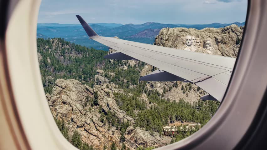 Aerial view of Mount Rushmore from the airplane window, Mount Rushmore National Memorial in the Black Hills region of South Dakota Royalty-Free Stock Footage #3487050425