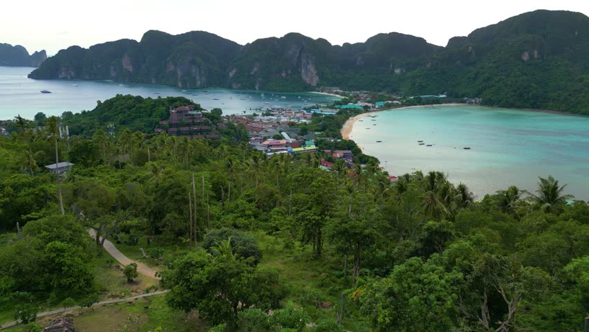 The Phi Phi Islands aerial view. Rocky tropical islands and paradise beachThe Phi Phi Islands are an island group in Thailand between the large island of Phuket and the Straits of Malacca coast 