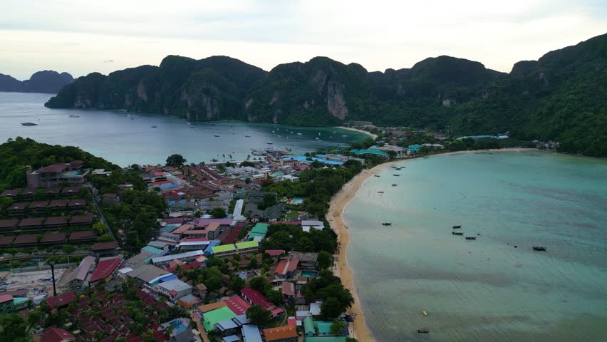 The Phi Phi Islands aerial view. Rocky tropical islands and paradise beachThe Phi Phi Islands are an island group in Thailand between the large island of Phuket and the Straits of Malacca coast 