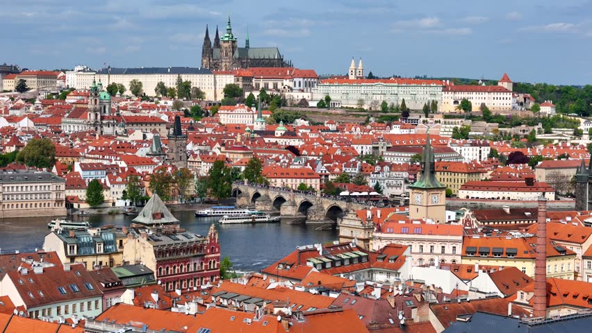 Prague, capital city of the Czech Republic, is bisected by the Vltava River. Charles Bridge is a medieval stone arch bridge that crosses the Vltava river in Prague, Czech Republic.