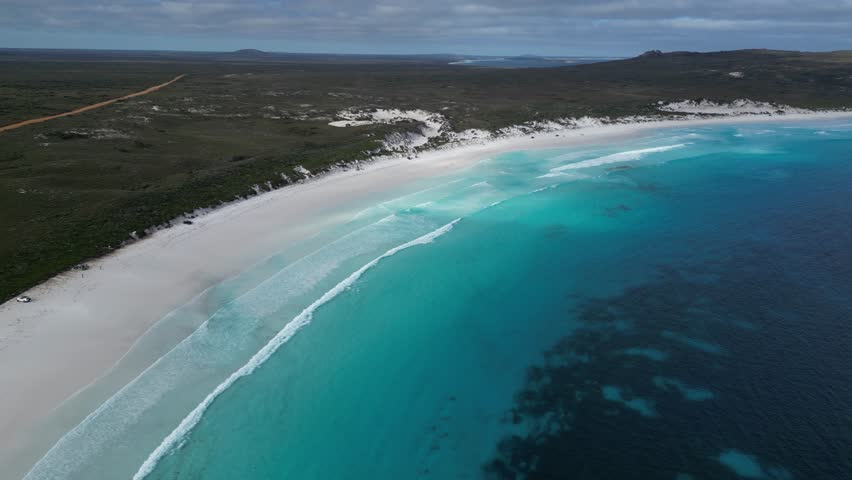 Lucky Bay beach with white sand and turquoise ocean waters, Cape Le Grand National Park, Western Australia. Aerial drone panoramic view and slow-motion