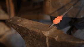 Blacksmith work. The blacksmith does arrow from metal.