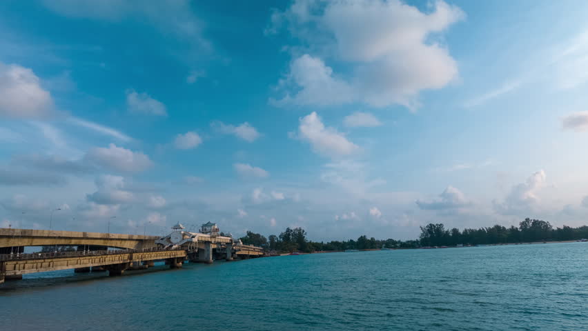 Time lapse blue sea White cloud in blue sky above Sarasin bridge viewpoint. Sarasin bridge is an important route connecting by land.
Sarasin bridge connect Phuket island to Phang Nga province.
 Royalty-Free Stock Footage #3487147137
