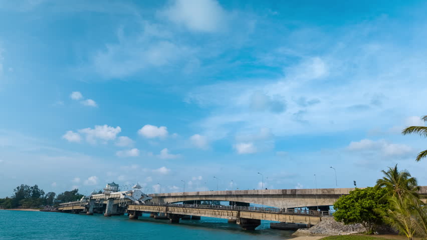 Time lapse blue sea White cloud in blue sky above Sarasin bridge viewpoint. Sarasin bridge is an important route connecting by land.
Sarasin bridge connect Phuket island to Phang Nga province.
 Royalty-Free Stock Footage #3487147983