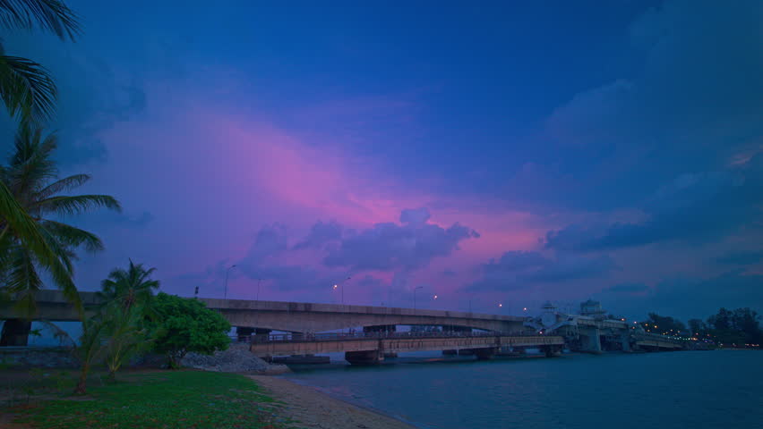 Time lapse pink cloud above Sarasin bridge at twilight.scenery sunset at Sarasin bridge. the bridge is the most important in making businesses 
from the provinces to Phuket has traded a lot of money Royalty-Free Stock Footage #3487148753