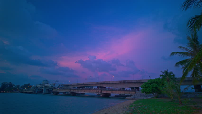 Time lapse pink cloud above Sarasin bridge at twilight.scenery sunset at Sarasin bridge. the bridge is the most important in making businesses 
from the provinces to Phuket has traded a lot of money Royalty-Free Stock Footage #3487149455