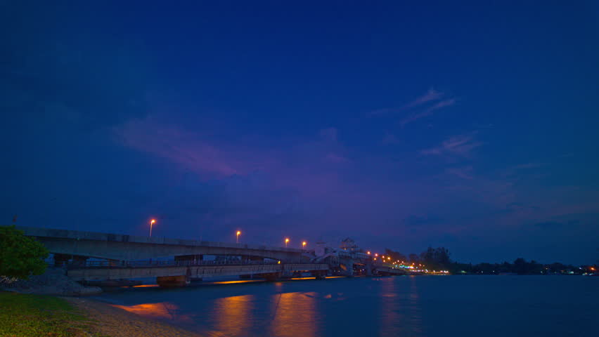 Time lapse pink cloud above Sarasin bridge at twilight.scenery sunset at Sarasin bridge. the bridge is the most important in making businesses 
from the provinces to Phuket has traded a lot of money Royalty-Free Stock Footage #3487149689