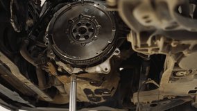 Mechanic installs new clutch disc in car. Automotive repair workshop scene, hands replace worn components. Vehicle maintenance, clutch assembly, gearbox service. DIY auto workshop instruction. - Powered by Shutterstock - Get 15% off with code: PIKWIZARD15