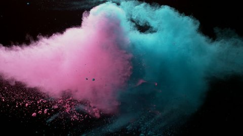 Colorful powder. ping powder, green powder, blue powder,Powder exploding against black background. Shot with high speed camera, Slow Motion.