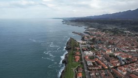 Drone, aerial 4k video view of beautiful coastal city of Llanes, Spain in Asturias