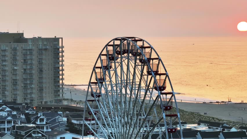Sunrise in Ocean City, NJ with the ferris wheel looking on.