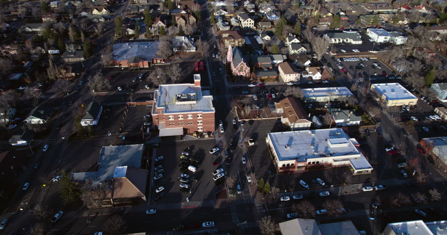 Downtown Flagstaff, Arizona USA, Aerial View of Church, Buildings and Street Traffic on Winter Day