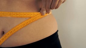 Waist Measuring. Losing Weight On Stomach. Weight Loss Motivation. Slimming Diet Result. Losing Weight Waist Measuring Tape. Weight Loss Diet Slimming Measure Tape. Fitness Shape Diet Achievement - Powered by Shutterstock - Get 15% off with code: PIKWIZARD15
